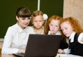Teacher and students use computers in the classroom Royalty Free Stock Photo