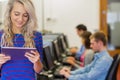 Teacher with students using computers in computer room Royalty Free Stock Photo