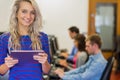 Teacher with students using computers in computer room Royalty Free Stock Photo