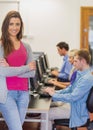 Teacher with students using computers in computer room Royalty Free Stock Photo