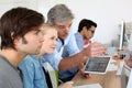 Teacher with students using electronical devices Royalty Free Stock Photo