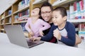 Teacher with students using a laptop Royalty Free Stock Photo