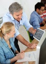 Teacher with students using tablet in class Royalty Free Stock Photo