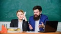 Teacher and supervisor working in school classroom. School educator and schoolmaster different opinion. School staff Royalty Free Stock Photo