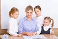 Teacher surrounded by her pupils