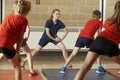 Teacher Taking Exercise Class In School Gym Royalty Free Stock Photo