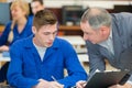 teacher talking to apprentice mechanic Royalty Free Stock Photo