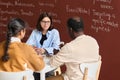 Teacher talking to father during parent meeting Royalty Free Stock Photo