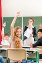 Teacher teaching a class of pupils in school Royalty Free Stock Photo