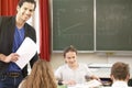 Teacher teaching or educate at the board a class in school Royalty Free Stock Photo