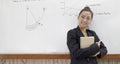 Teacher is teaching physics to students during the new school days after a long break, High school student classroom