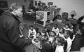 Teacher teaching small children in a elemtary school