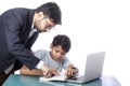 Teacher teaching student with the help of computer technology Royalty Free Stock Photo