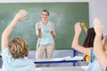 Teacher teaching students in class Royalty Free Stock Photo