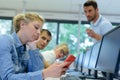 teacher telling off student chatting with smartphone in classroom Royalty Free Stock Photo