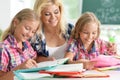 Portrait of teacher with two schoolgirls during lesson Royalty Free Stock Photo