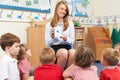 Teacher Using Flash Cards To Teach Maths To Elementary Class Royalty Free Stock Photo