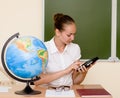 Teacher using a tablet computer at classroom Royalty Free Stock Photo