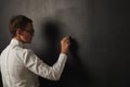 Teacher in white blouse at the blackboard Royalty Free Stock Photo