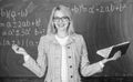 Teacher woman with book chalkboard background. Why teacher quit off sick with stress. Overwork and lack of support