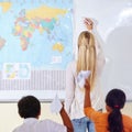 Teacher, woman and children in a classroom, learning and knowledge with information, paper planes and studying. Students Royalty Free Stock Photo