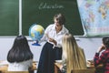 Teacher woman happy young students leads a lesson