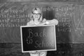 Teacher woman hold blackboard inscription back to school. It is school time again. School teacher glad to welcome pupils Royalty Free Stock Photo
