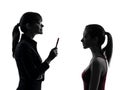 Teacher woman mother teenager girl discussion in silhouette uet Royalty Free Stock Photo