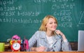 Teacher woman sit table chalkboard background. Organize class and make learning easy and meaningful process. Excellent