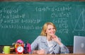 Teacher woman sit table chalkboard background. Organize class and make learning easy and meaningful process. Well Royalty Free Stock Photo