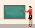 Teacher woman standing in front of blank school blackboard