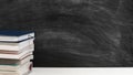 Teacher workplace books desk empty chalkboard Royalty Free Stock Photo