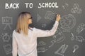 A Teacher writes on blackboard Back to School Royalty Free Stock Photo