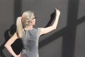 Teacher writing with white chalk on empty blackboard in classroom Royalty Free Stock Photo