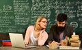 In teachers classroom each persons ideas and opinions are valued, Portrait of diligent schoolkid and teacher talking at