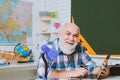 Teachers day. Back to school and happy time. Learning and education concept School teacher in front of chalkboard. Royalty Free Stock Photo