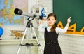 Teachers day. Little girl using telescope. Telescope on tripod. School subjects set. School astronomy lesson. Exploring