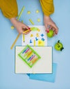 Teachers hands and mathematical stationery. Solving maths exercises.Teachers hands holding bright mathematical stationery Royalty Free Stock Photo