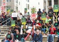 Teachers and supporters holding signs protesting at a Teacher Strike Rally in Oakland, CA