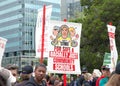 Teachers and supporters holding signs protesting at a Teacher Strike Rally in Oakland, CA