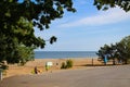 Teachers take young children in yellow vests and yellow bandanas to the beach to the sea