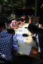 Teachers are teaching children how to write callig
