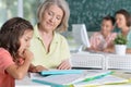 Teachers working with pupils Royalty Free Stock Photo