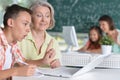 Teachers working with pupils Royalty Free Stock Photo