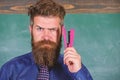 Teaching memorization techniques. Back to school and studying. Teacher bearded man with pink stapler chalkboard