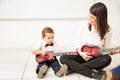 Teaching music to a toddler Royalty Free Stock Photo