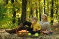 Teaching son healthy nutrition. Having snack picnic hike. Happy childhood. Mother pretty woman and little son relaxing Royalty Free Stock Photo