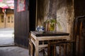Teacups on table at door of aged Chinese house Royalty Free Stock Photo