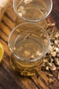 Teaglass with yellowhead root tea Royalty Free Stock Photo