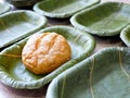 Teak leaf dish plate organic pure green whole wheat bread bun nature natural selected focus Royalty Free Stock Photo